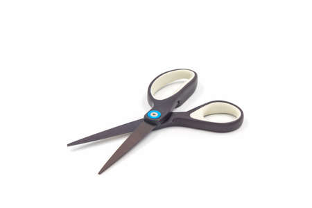 Single black steel scissors isolated on white background.の写真素材