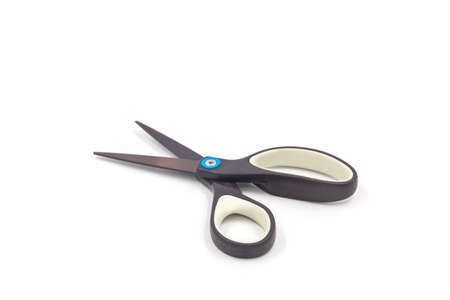 Single black steel scissors isolated on white background.の写真素材