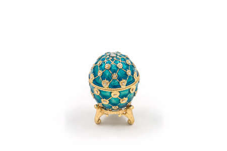 Faberge eggs on white background. Decorative ceramic easter egg for jewellery.のeditorial素材