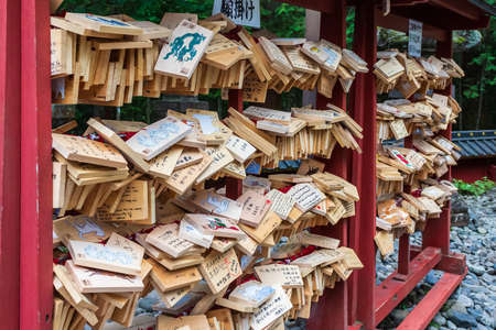 Nikko, Japan - October 15, 2018: A Japanese votive plaque(Ema) hanging in Nikko Toshogu Shrine temple, Ema are small wooden plaques used for wishes by shinto believers.のeditorial素材