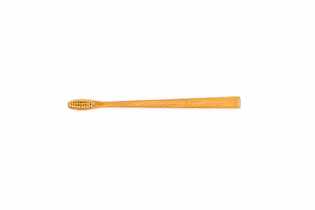 Close up bamboo toothbrush on white background.の写真素材