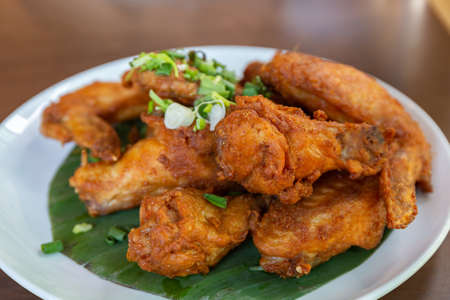 Fried Chicken Wings with Fish Sauce on White Plate.  の写真素材