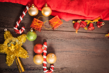 Christmas gift box, food decor and fir tree branch on wooden table. Top view with copy spaceの写真素材