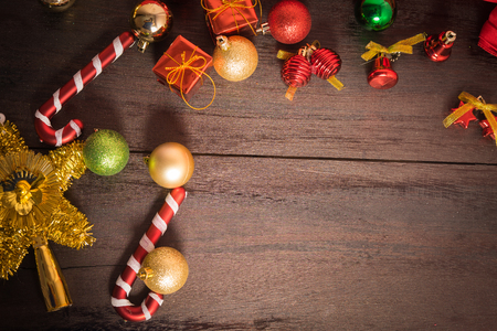 Christmas gift box, food decor and fir tree branch on wooden table. Top view with copy spaceの写真素材