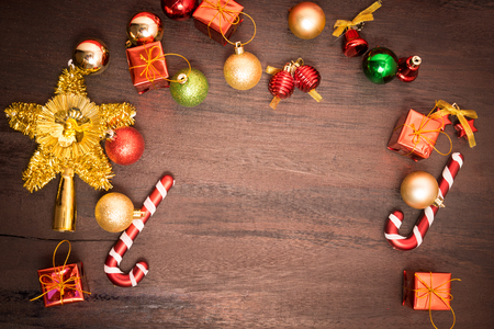Christmas gift box, food decor and fir tree branch on wooden table. Top view with copy spaceの写真素材