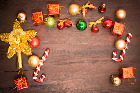 Christmas gift box, food decor and fir tree branch on wooden table. Top view with copy spaceの写真素材