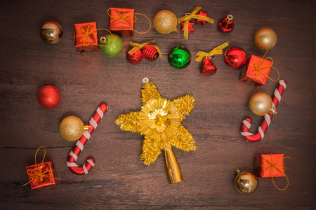 Christmas gift box, food decor and fir tree branch on wooden table. Top view with copy spaceの写真素材
