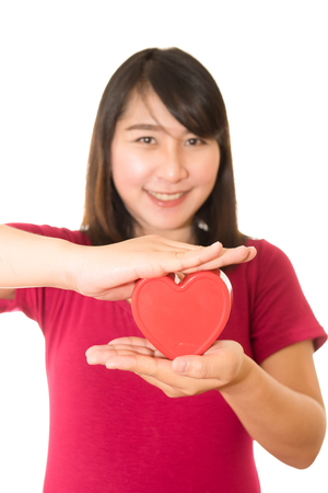 Woman show heart hands isolated on whiteの写真素材
