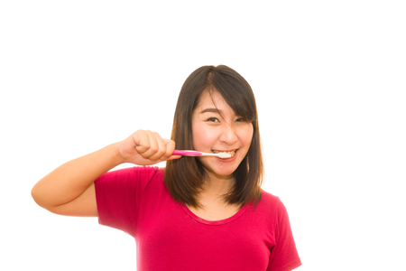 Attractive naked woman with toothbrush. Isolated on white.の写真素材