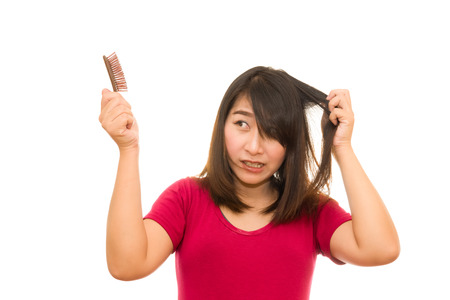 Asian girl worried about hair loss,Hair lossの写真素材