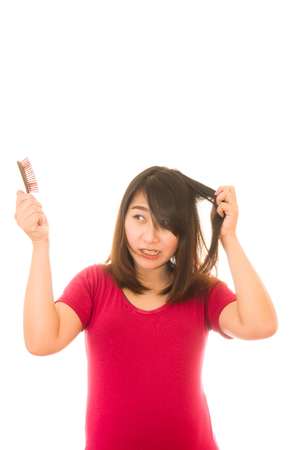 Asian girl worried about hair loss,Hair lossの写真素材