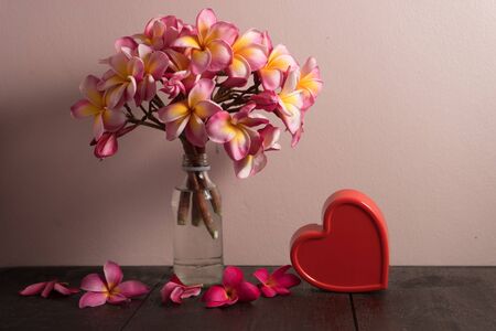 Valentines Day background with hearts and pink flower still lifeの写真素材