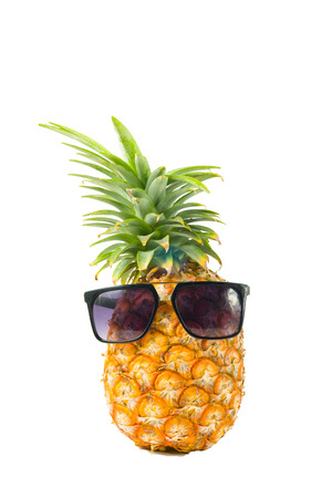 Pineapple wearing sunglasses - Summertime vacation holiday eating healthy concept imageの写真素材