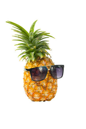 Pineapple wearing sunglasses - Summertime vacation holiday eating healthy concept imageの写真素材