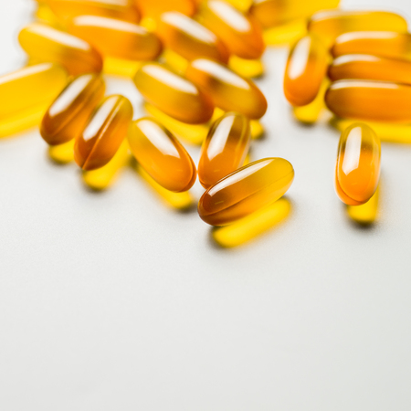 Vitamin e. Fish oil capsules on white background. Copy space for your text, high resolution product.の写真素材
