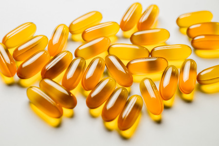 Vitamin e. Fish oil capsules on white background. Copy space for your text, high resolution product.の写真素材