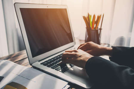 Business woman using laptop computer in the office