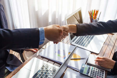 Business people shaking hands. Business executives to congratulate the joint.