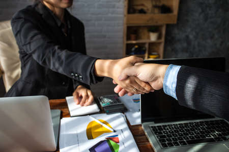 Business people shaking hands. Business executives to congratulate the joint.