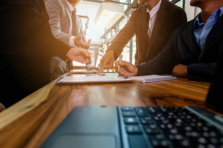 usiness people meeting at working with financial reports