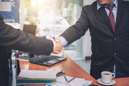 Business shaking hands. Business executives to congratulate the joint.の写真素材