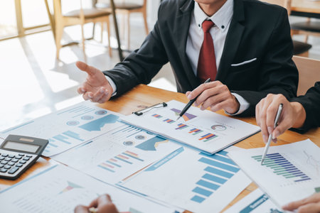 Investor group, business meeting and financial graph data analysis during the meeting.の写真素材