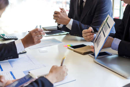 Group of business people meeting to discuss financial investment and marketing.