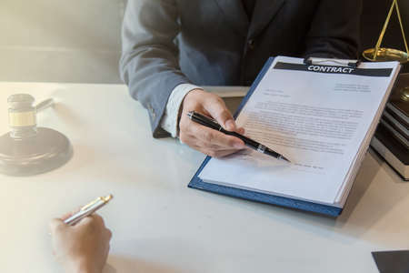 Businessman signed a contract agreement to invest together.の写真素材