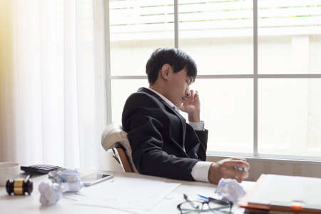 Businessman feeling sick and tired. Businessman who feel stressed out of workの写真素材