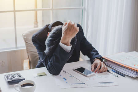 Business man unhappy in their work. Despair failed to work.の写真素材