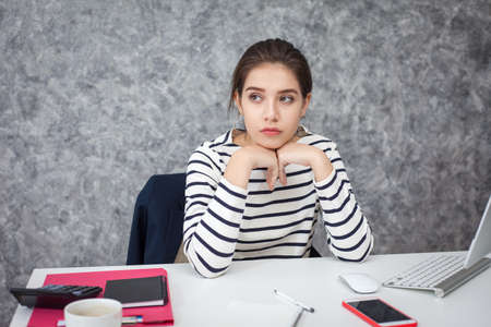 Feeling tired. Beautiful Young woman feeling stress from work.の写真素材