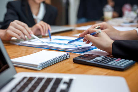 Teamwork process, business people working in the office discussing documents and ideas at meetingの写真素材