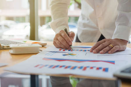 Businessman working with office finance documentsの写真素材