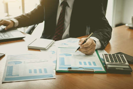 Businessman at working with financial reportsの写真素材