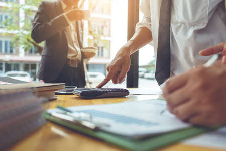 Teamwork process, business people working in the office discussing documents and ideas at meetingの写真素材