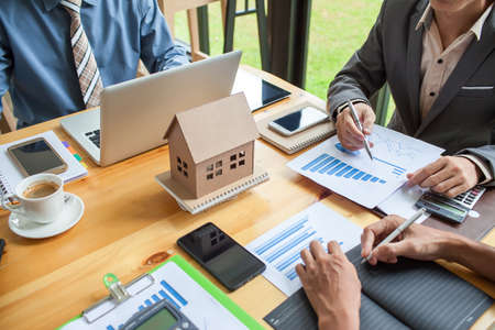 Business meeting of real estate broker, Business meeting working with new startup project. Idea presentation analyze plan.の写真素材