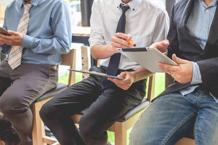 Business people meeting at working with financial reports and a tabletの写真素材