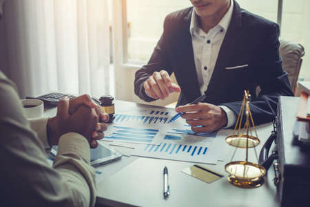 Business lawyer working about legal legislation in courtroom to help their customerの写真素材