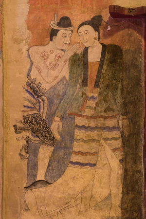 Famous mural painting of a man whispering to the ear of a womanの写真素材
