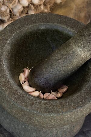 Garlic in granite mortarの写真素材