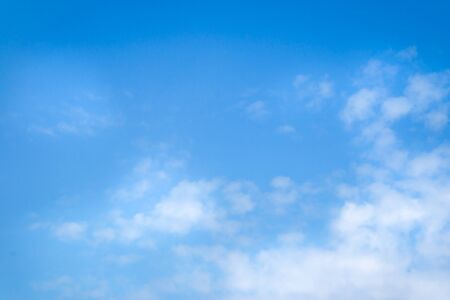 Blue sky with white cloud backgroundの写真素材