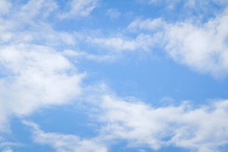 Blue sky with white cloud backgroundの写真素材