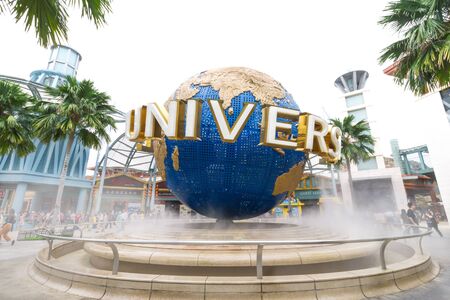 UNIVERSAL STUDIOS SINGAPORE - FEBRUARY 2 2017 : The large rotating globe fountain in front of...