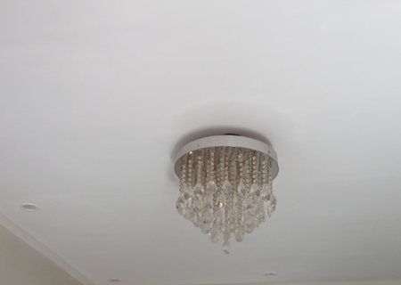 Ceiling chandelier on white ceiling. Ceiling lampの写真素材