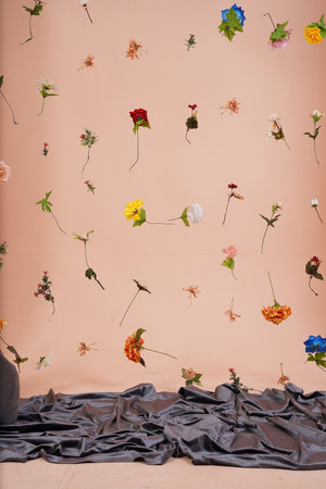 Flowers on the floor in the interior of the room. The wall is decorated with flowers.の写真素材