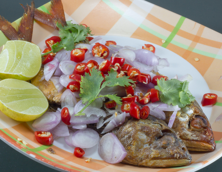 Salted fish Spicy salted with lemonPepper and Onionsの写真素材