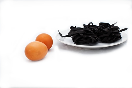 black pasta with eggsの写真素材