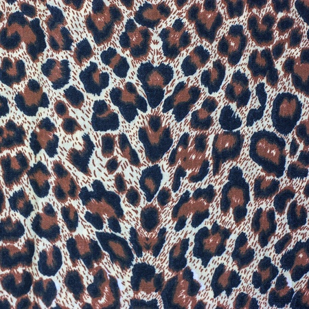 Leopard spots background with fabric texture