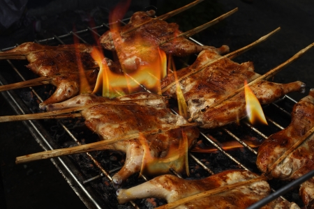 roast chicken on the grill の写真素材
