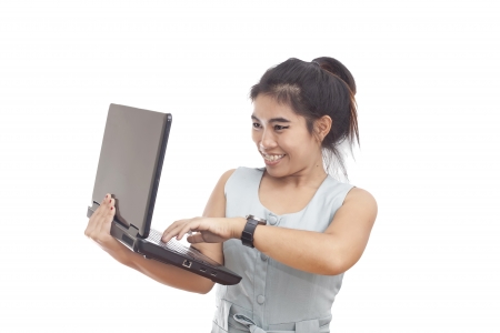 Young attractive businesswoman holds a laptopの写真素材